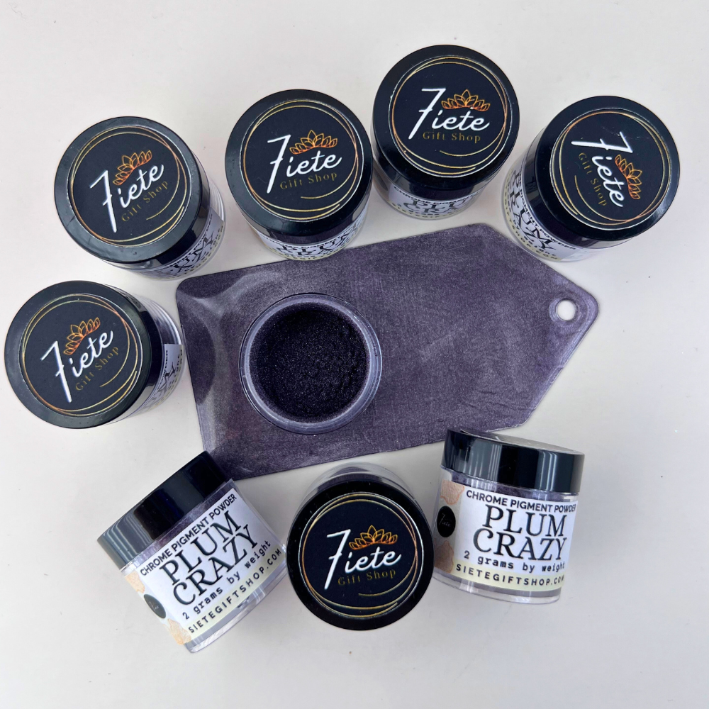 Jars of Plum Crazy chrome pigment powder from Siete Gift Shop displayed with a purple swatch sample showing a deep metallic plum finish.