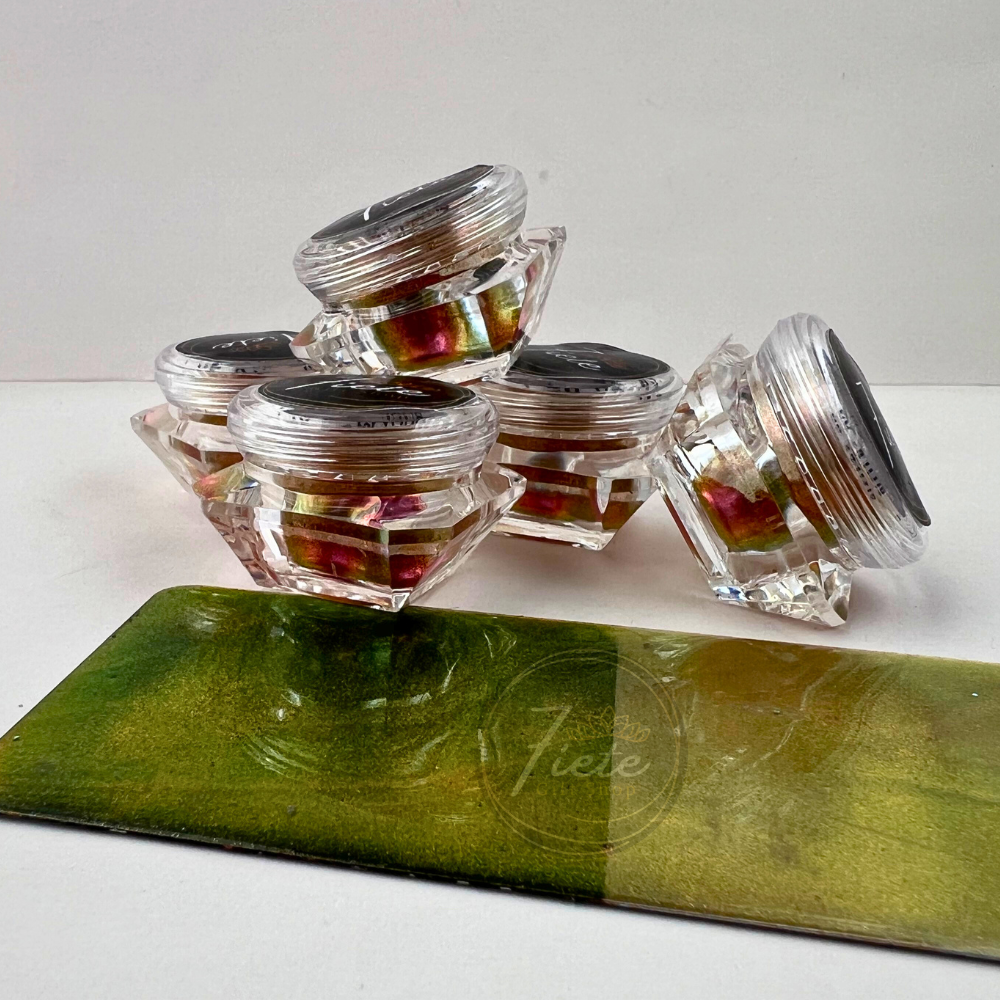 Jar of Organza chameleon pastel pigment powder from Siete Gift Shop showing gold, coral, and green color shift with pigment swatch