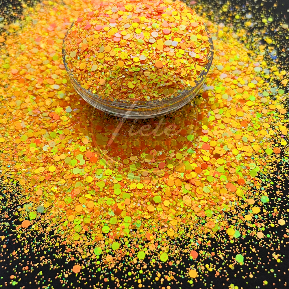 Sunburst glow in the dark glitter mix with chunky orange, yellow, and gold tones that sparkle in light and glow at night.