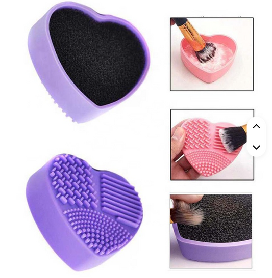 Brush Buddy heart-shaped silicone brush cleaning tool with textured scrubber and sponge insert, used to clean glitter and pigment brushes for crafting and tumbler making.