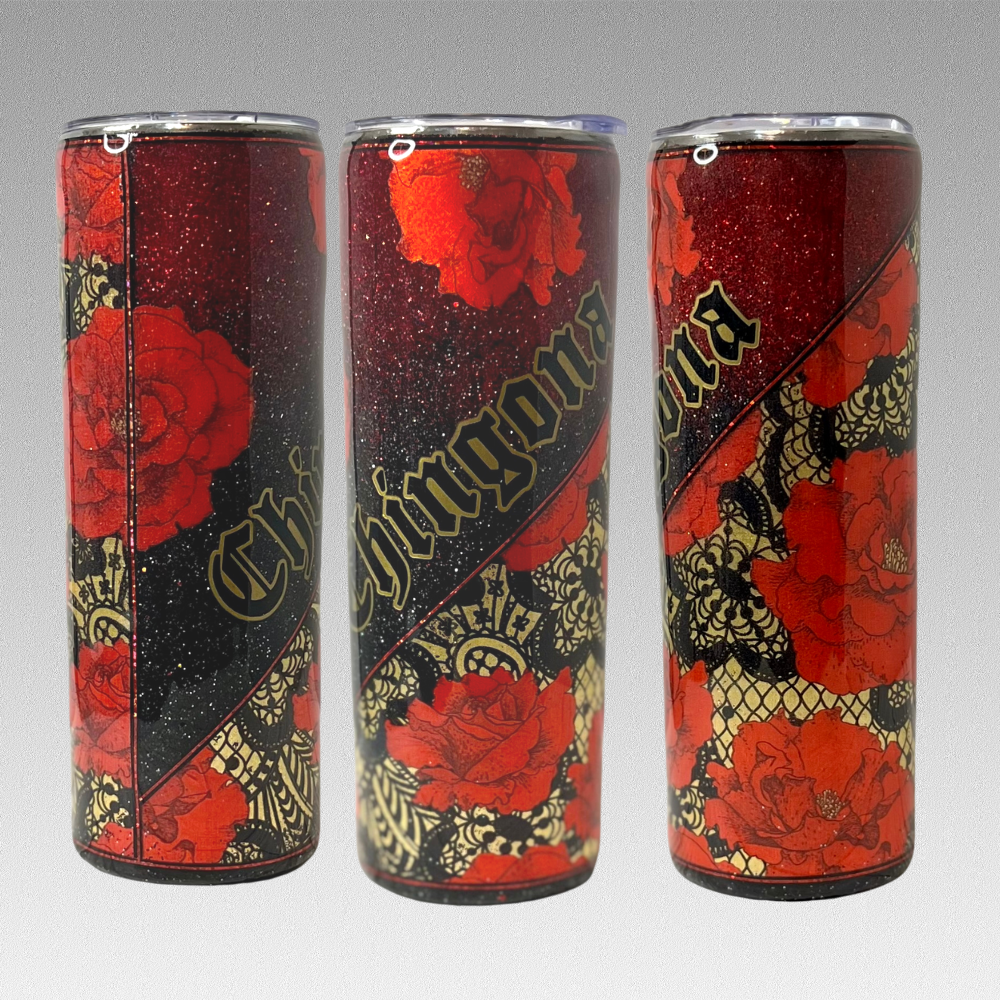 20oz tumbler showing three sides of the tumbler. It has a diagonal cut of vinyl, the vinyl has a dark gold background over lapped with black lace and red roses blooming with gold centers. The other quarter part has an ombre design with black and deep reads. The word "CHINGONA" is placed diagonal over the glitter.