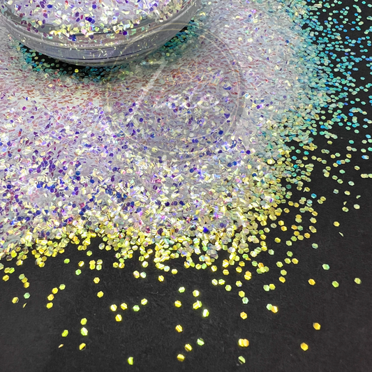 Close-up of Green Diamonds baby bubble glitter, featuring iridescent green and diamond-like sparkles with a color-shifting shine, displayed on a black background for tumblers, resin art, and crafts.