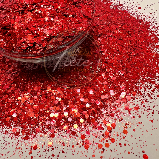 Close-up of Queen of Hearts red chunky glitter mix with fine, medium, and large cuts in various shapes, perfect for tumblers, resin crafts, and DIY projects.
