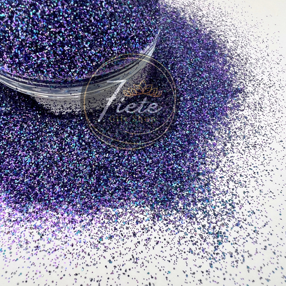 "Masquerade glitter blend in rich jewel tones of purple, green, and gold with iridescent sparkle in a premium craft glitter mix."