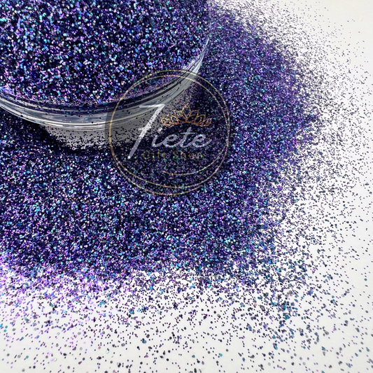 "Masquerade glitter blend in rich jewel tones of purple, green, and gold with iridescent sparkle in a premium craft glitter mix."