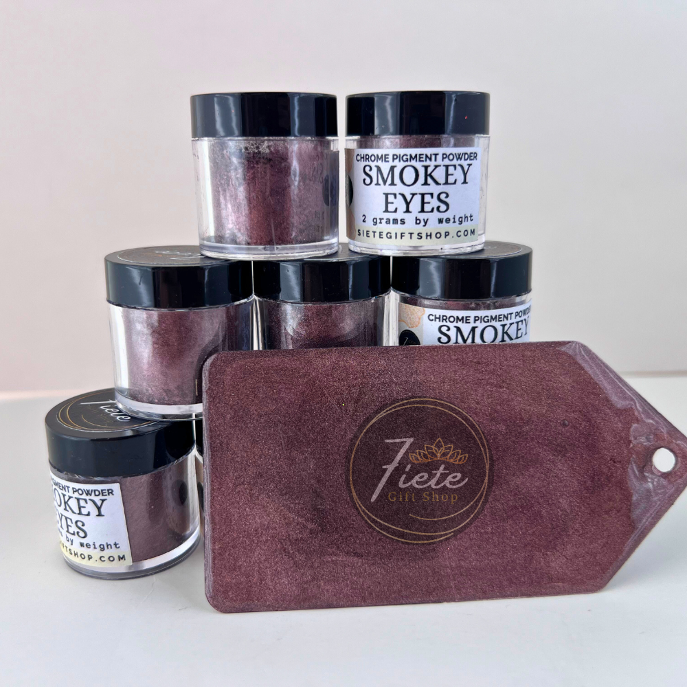 Jars of 'Smokey Eyes' powder and a maroon pouch with 'Siete Gift Shop' logo on a white background