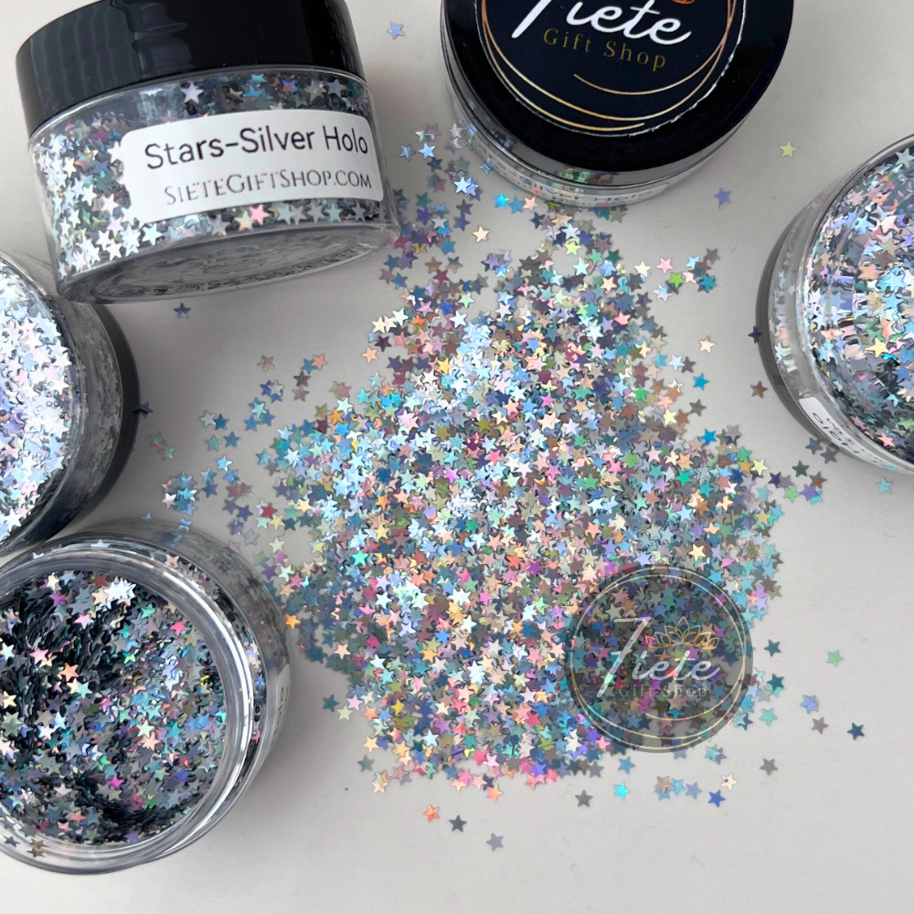 Silver holographic star-shaped glitter scattered on a light surface with rainbow reflective shine, Star – Silver Holographic Glitter by Siete Gift Shop