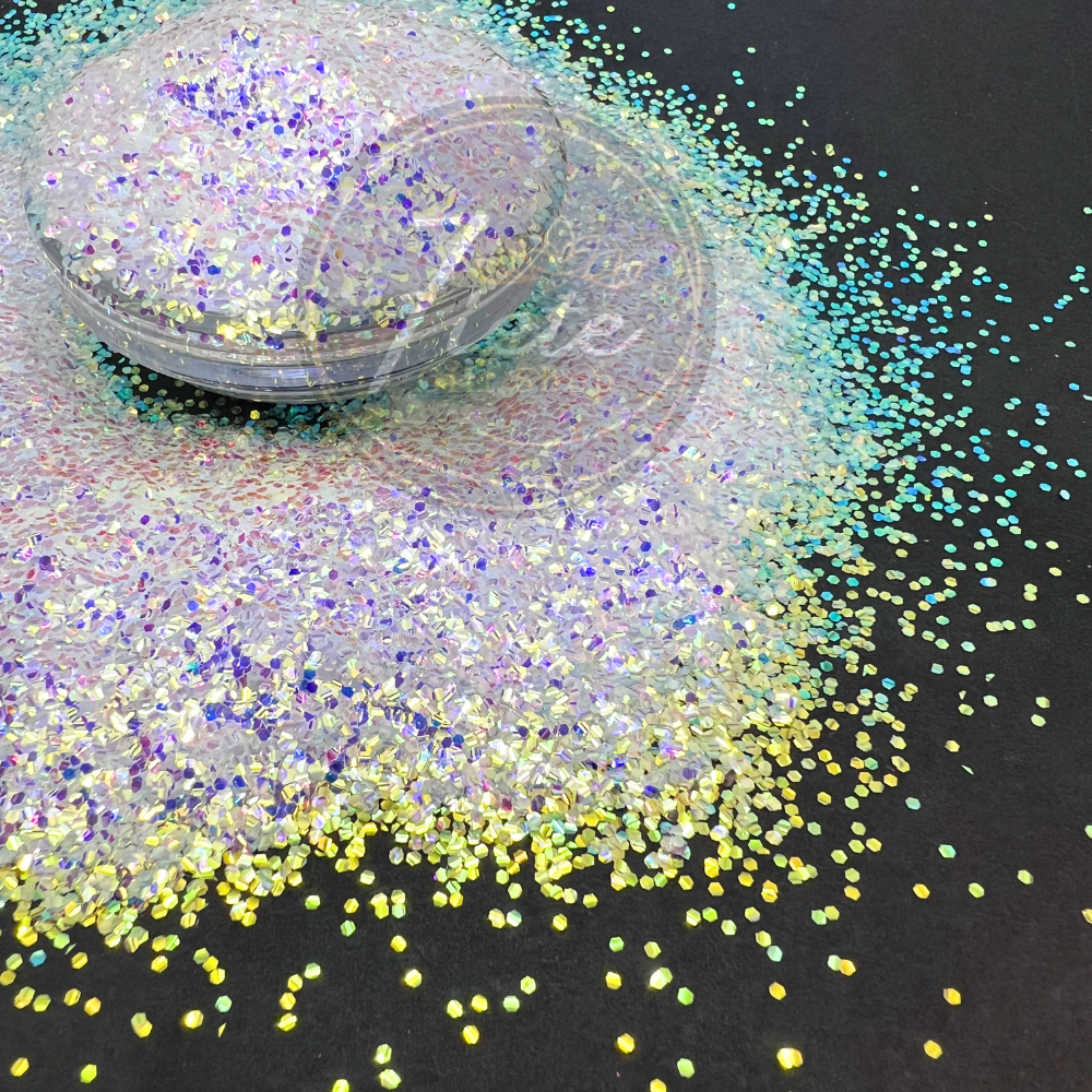 Close-up of Green Diamonds baby bubble glitter, featuring iridescent green and diamond-like sparkles with a color-shifting shine, displayed on a black background for tumblers, resin art, and crafts.