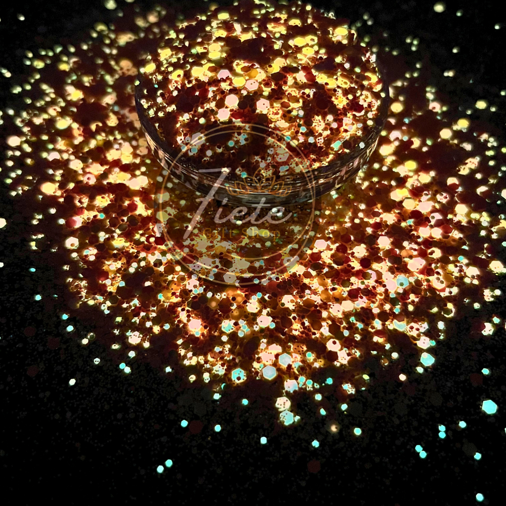 Sunburst glow in the dark glitter mix with chunky orange, yellow, and gold tones that sparkle in light and glow at night.