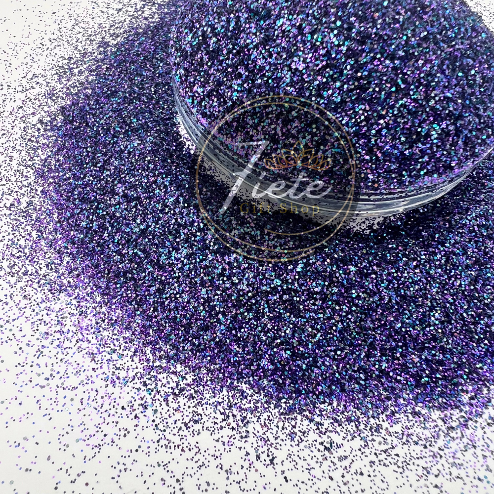 "Masquerade glitter blend in rich jewel tones of purple, green, and gold with iridescent sparkle in a premium craft glitter mix."