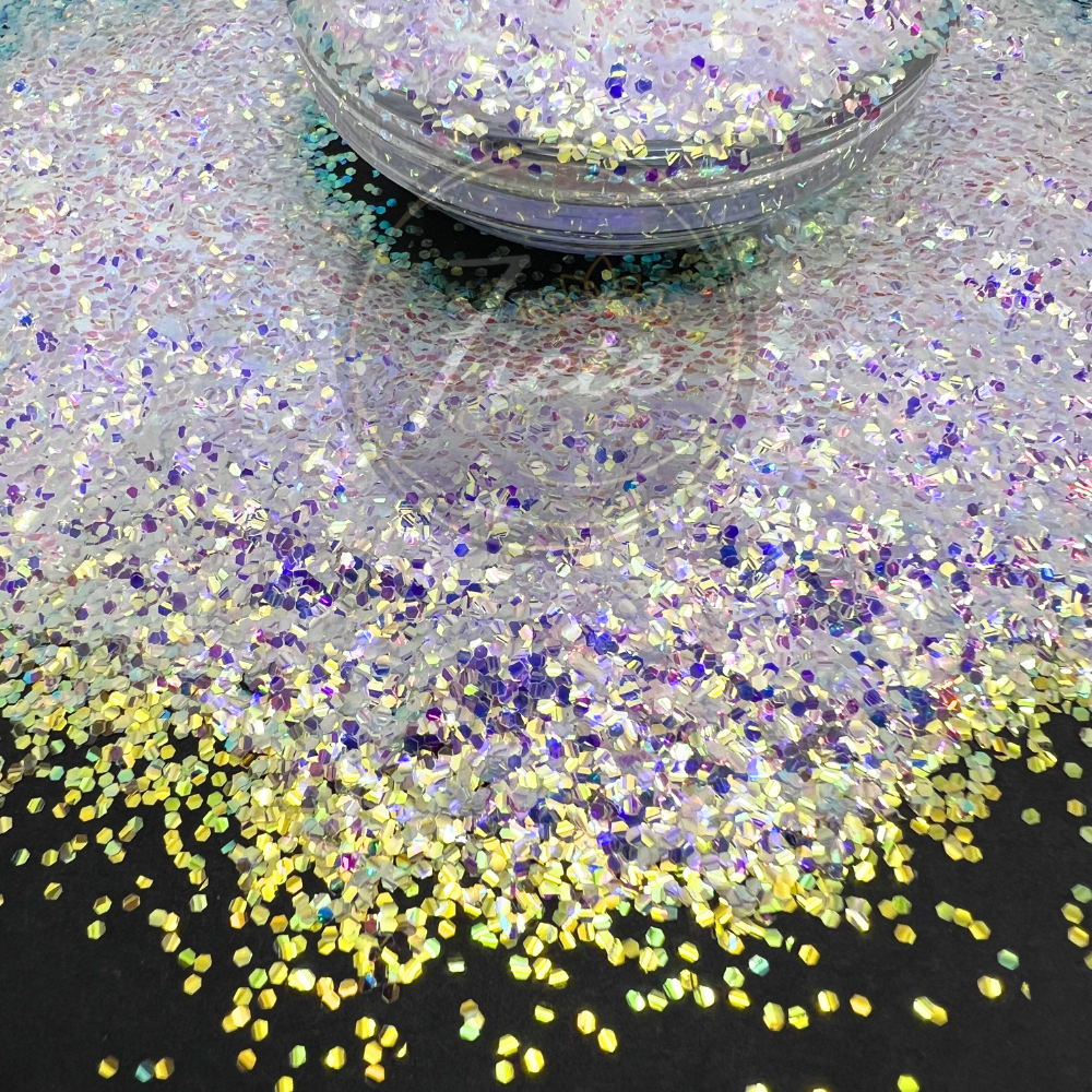Close-up of Green Diamonds baby bubble glitter, featuring iridescent green and diamond-like sparkles with a color-shifting shine, displayed on a black background for tumblers, resin art, and crafts.